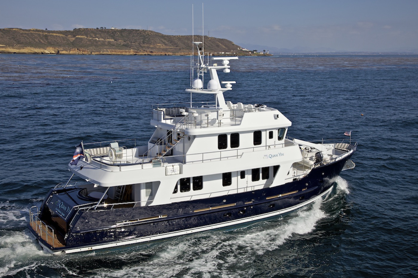 Expedition motor yacht underway in open coastal water